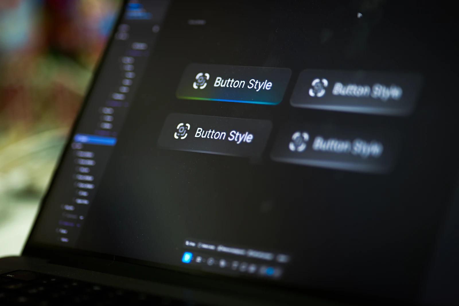 A laptop screen showing four variations of a button style